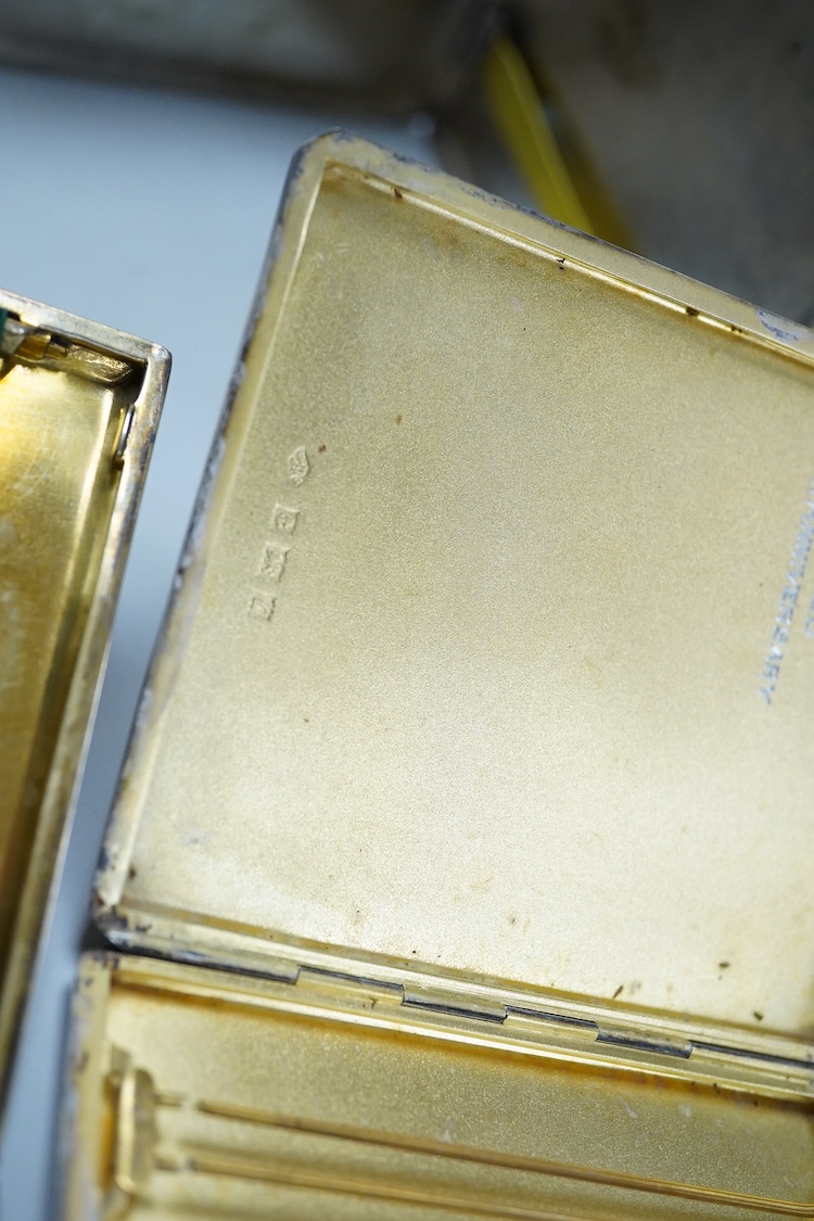 Nine assorted silver cigarette cases, including an Edwardian ribbed case and an engine turned rectangular case by Garrard & Co, Birmingham, 1960, 12.7cm, 32.1oz and one other unmarked white metal cigarette case.